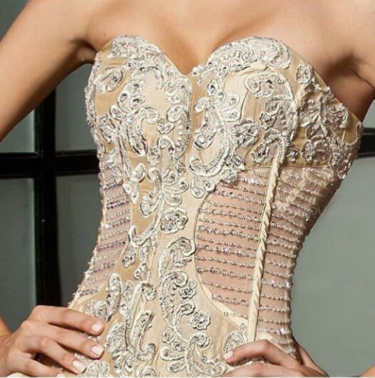 Ornate beaded corset with ivory and crystal embellishments